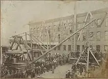 Old photo of the cathedral before completion shows the east end finished and roofed, while other parts of the building are in various stages of construction.