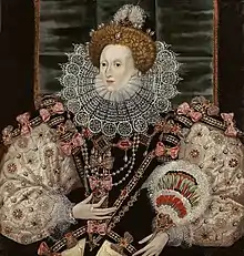 A three-quarter portrait of a middle-aged woman wearing a tiara, bodice, puffed-out sleeves, and a lace ruff.  The outfit is heavily decorated with patterns and jewels.  Her face is pale, her hair light brown.  The backdrop is mostly black.